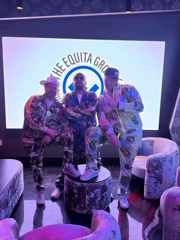 The Equita Group leadership team on stage at a company event